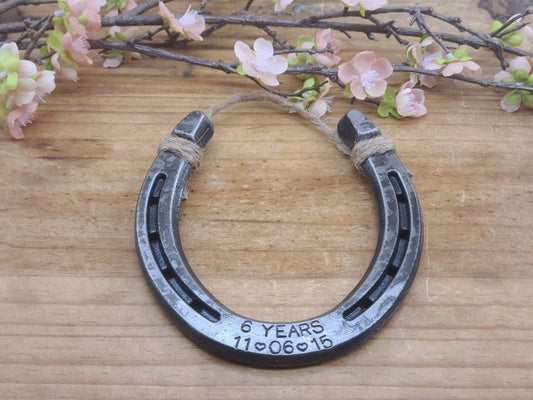 Horseshoe wall decor with 6 years and wedding anniversary stamped on it
