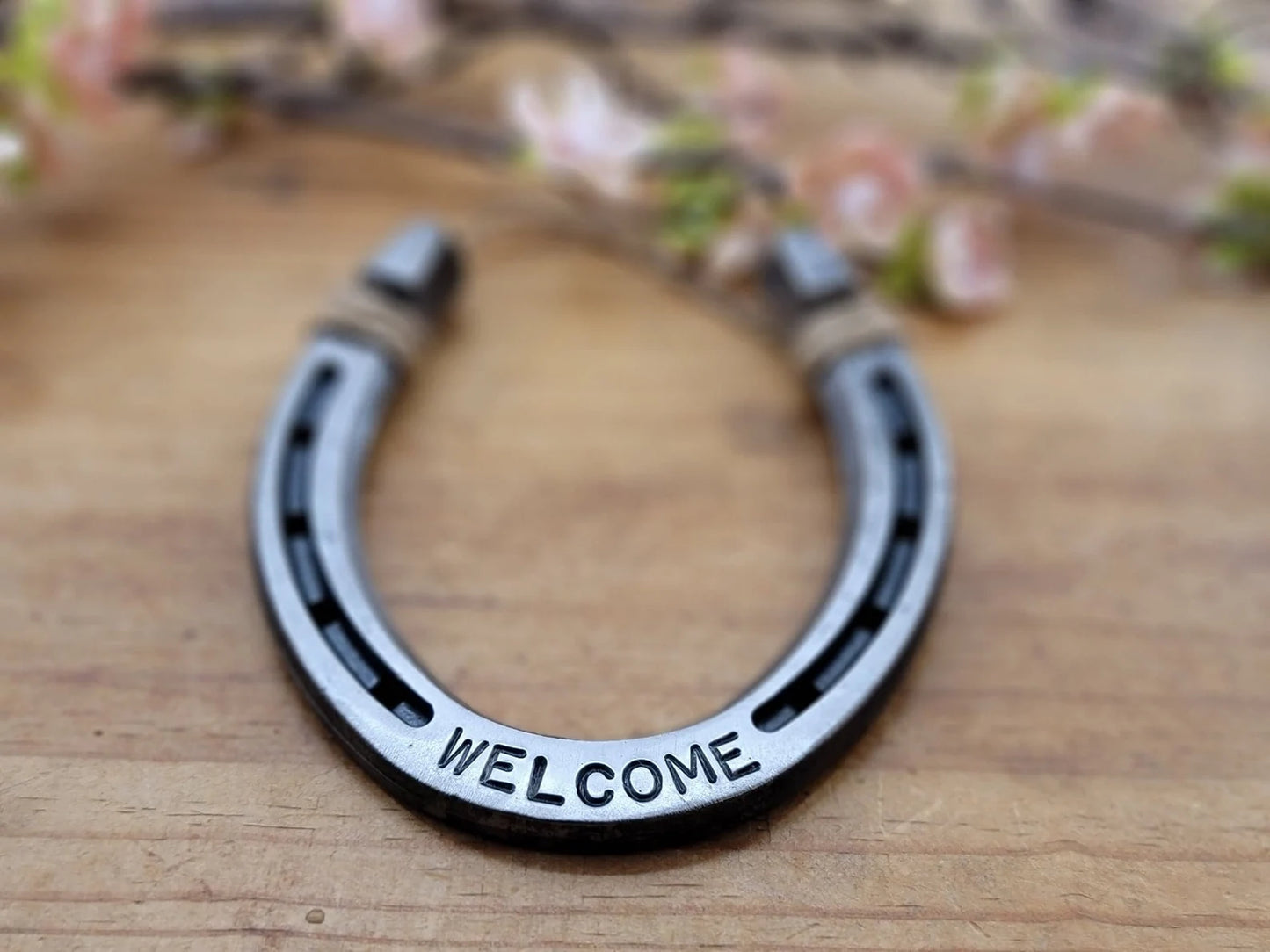 Real horseshoe with the word WELCOME on it along the bottom