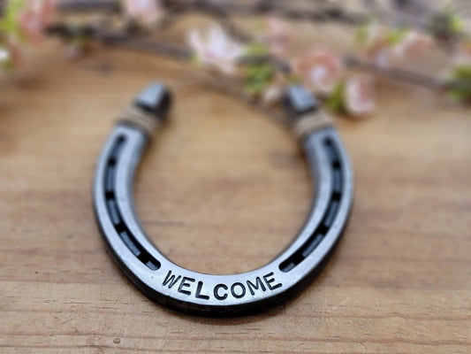 Real horseshoe with the word WELCOME on it along the bottom