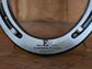 Real metal horseshoe engraved along the bottom with a logo of a company 