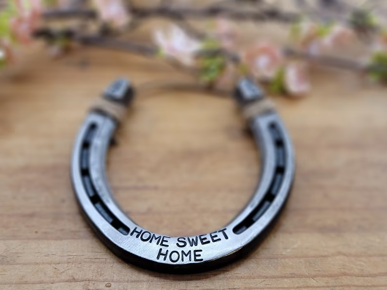 Real horseshoe decor with 'HOME SWEET HOME' stamped along the bottom