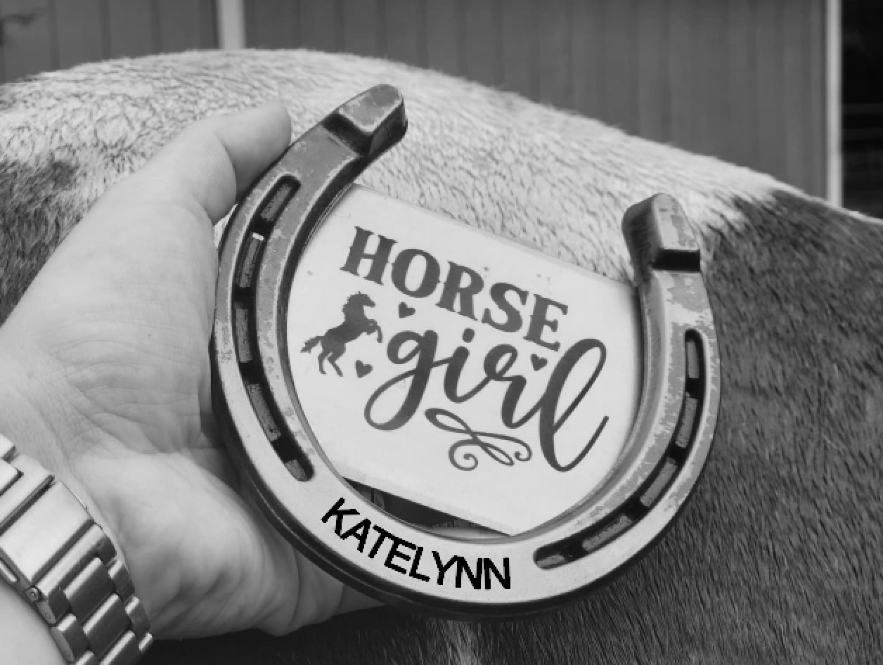 Personalized horseshoe with a name along the bottom and 'Horse Girl' text and hearts engraved in the center. A thoughtful equestrian gift