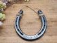 Real horseshoe engraved with anniversary date along the bottom. Jute string attached at the top for hanging.