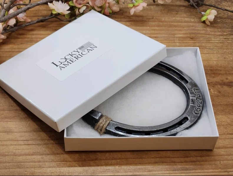 Authentic horseshoe keepsake with 6 tally marks engraved along the bottom plus the anniversary date. Displayed in a gift box.