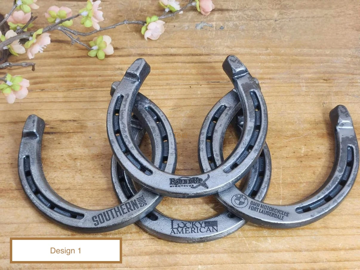 Multiple real horseshoes with different company logos engraved along the bottom toe portion of the horseshoe. Referred to as "Design 1"