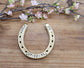 Personalized gold painted horseshoe with names and date for a 50 year wedding anniversary gift.