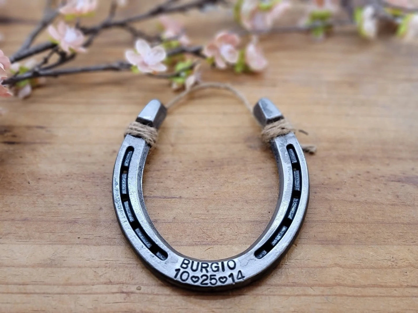 Real horseshoe personalized for an anniversary or wedding gift. Stamped with last name and date along the bottom of the horseshoe.