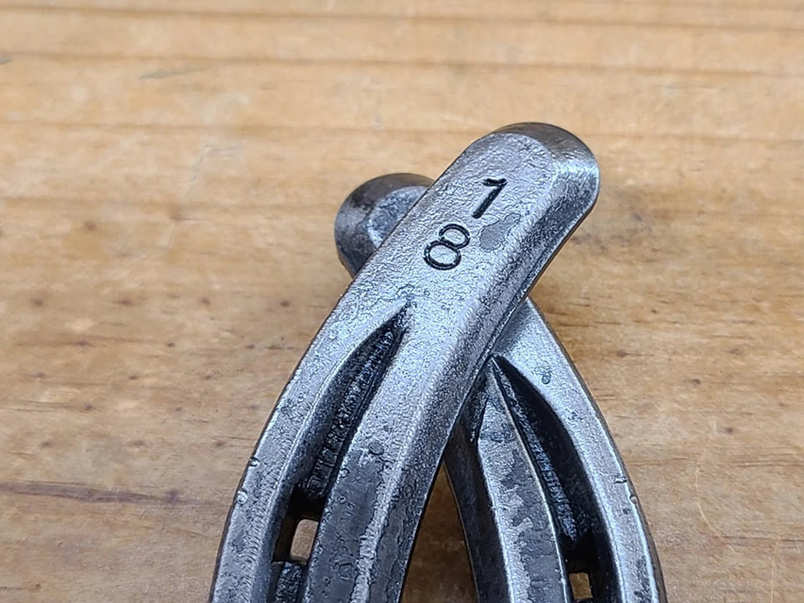 Close up with of numbers stamped on a real horseshoe