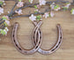 Real horseshoes painted copper to celebrate the 7 year anniversary. Personalized with names along the bottom and wedding date along the top.
